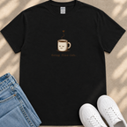 A black t-shirt with a coffee cup graphic and the text "going fine-ish" printed on it, along with a pair of blue jeans and white sneakers.