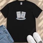 a black t-shirt with a graphic design, a pair of blue jeans, and a pair of white sneakers.