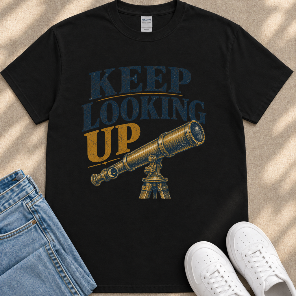 A black t-shirt with a graphic design featuring a telescope and the text "KEEP LOOKING UP" printed on it.