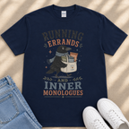 A navy blue t-shirt with a graphic design featuring a black bird holding a bag of chips and the text "RUNNING errands AND INNER MONOLOGUES".