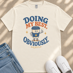 a white t-shirt with a graphic design that includes a coffee cup character and text, along with a pair of jeans and white sneakers.