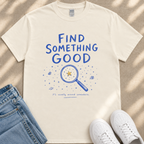 a white t-shirt with a blue graphic design and text, a pair of blue jeans, and a pair of white sneakers.