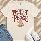 A white t-shirt with a graphic design featuring a candle and the text "PROTECT YOUR PEACE" printed on it.