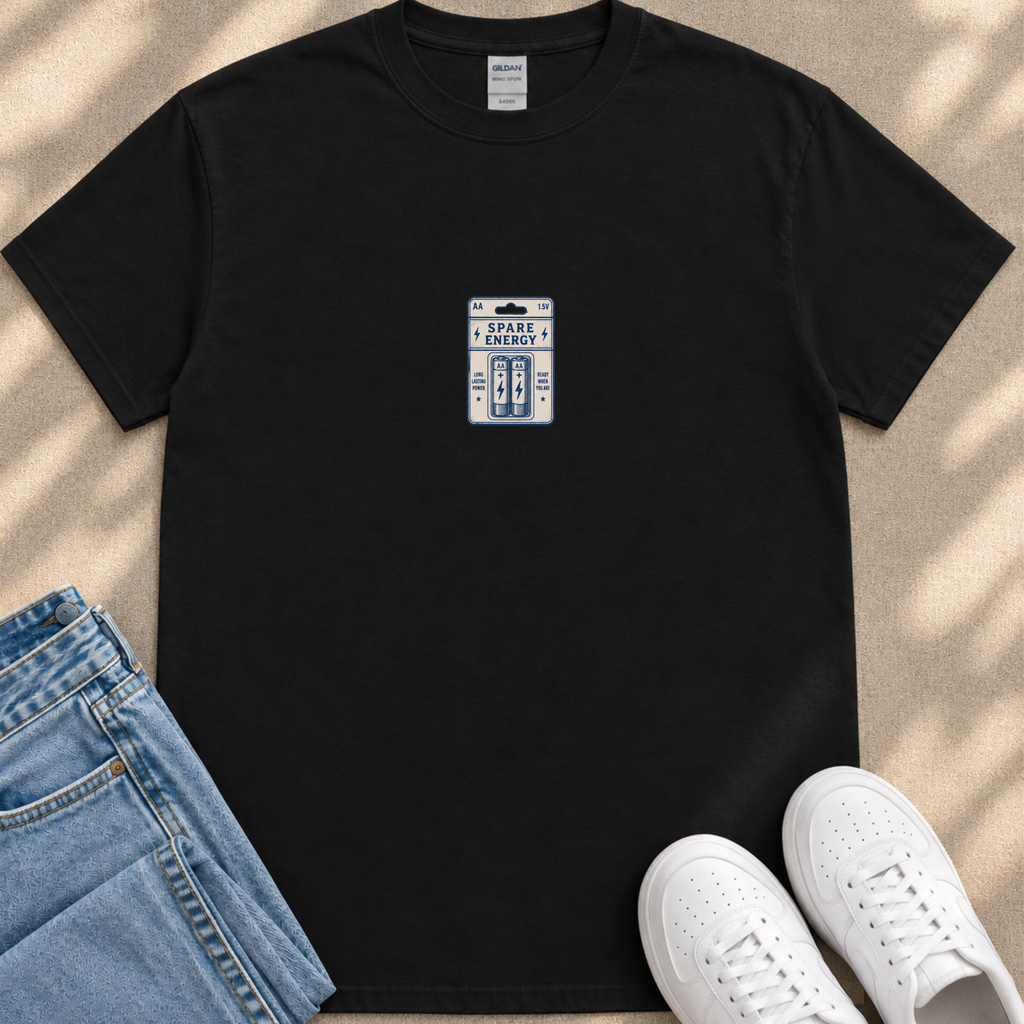 a black t-shirt with a small graphic design on it, placed on top of a pair of blue jeans and white sneakers.