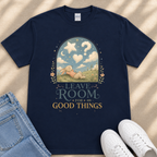 A navy blue t-shirt with a whimsical illustration of a rabbit in a field, along with the text "LEAVE ROOM FOR GOOD THINGS" printed on it.