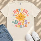 A white t-shirt with a colorful graphic design featuring a smiling sun and the text "Better Days Ahead" printed on it.