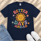 A navy blue t-shirt with a colorful graphic design featuring a smiling sun and the text "Better Days Ahead" printed on it.