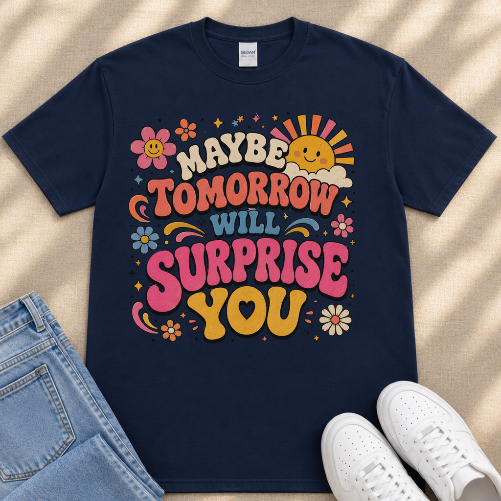 A navy blue t-shirt with a colorful graphic design featuring text and illustrations, along with a pair of jeans and white sneakers.