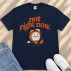 A navy blue t-shirt with a graphic design of a clock and the text "not right now."